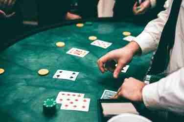 Croupier Dealing Cards In Casino